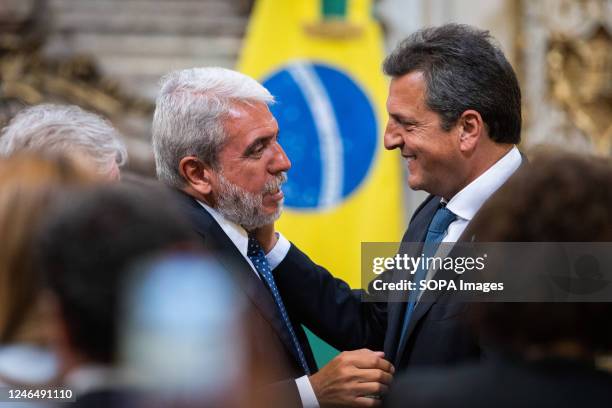 Anibal Fernandez , Minister of Security of the Argentine Nation speaks with the Minister of Economy Sergio Massa , during a press conference between...