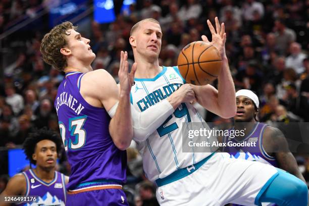 Lauri Markkanen of the Utah Jazz defends Mason Plumlee of the Charlotte Hornets during the second half of a game at Vivint Arena on January 23, 2023...