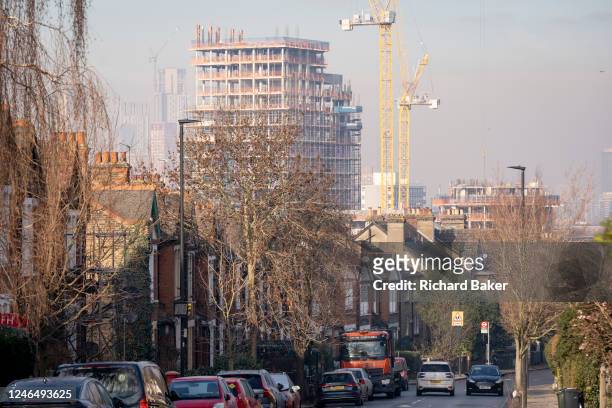 The tall high-rise residential development called Higgs Yard, rises with more storeys above existing local housing on Herne Hill in Lambeth, south...