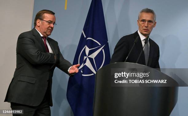 Germany's new Defence Minister Boris Pistorius and NATO chief Jens Stoltenberg arrive to give a joint press conference after talks on January 24,...