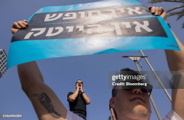 Demonstrator shouts slogans during a protest by tech workers against proposed judicial reforms in Tel Aviv, Israel, on Tuesday, Jan. 24, 2023....