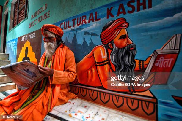 Hindu priest performs "Evening Aarati" prayers at Assi Ghat during the Ganga Aarti, a traditional and old Hindu ritual honoring the Ganges River.