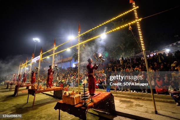 Hindu priests perform "Evening Aarati" prayers at Assi Ghat during the Ganga Aarti, a traditional and old Hindu ritual honoring the Ganges River.