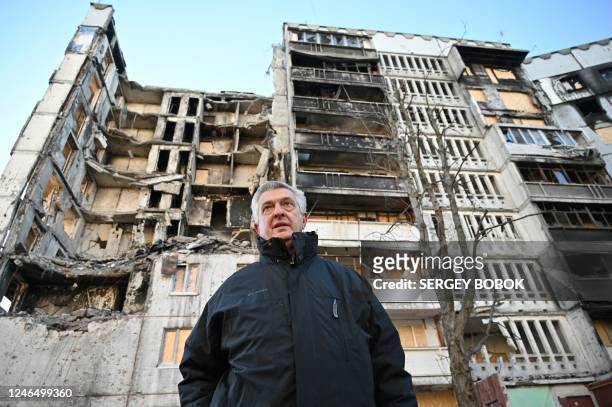 United Nations High Commissioner for Refugees Filippo Grandi examines buildings destroyed by shelling during his visit in the Ukrainian city of...