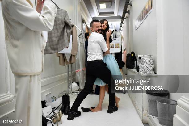 French fashion designer Julien Fournie poses with a model backstage before the presentation of his Haute-Couture Spring-Summer 2023-2024 collection...