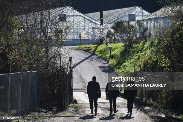 Agents enter to investigate the crime scene after shooting at the Spanish Town shops in Half Moon Bay, California, January 24, 2023. - An Asian farm...