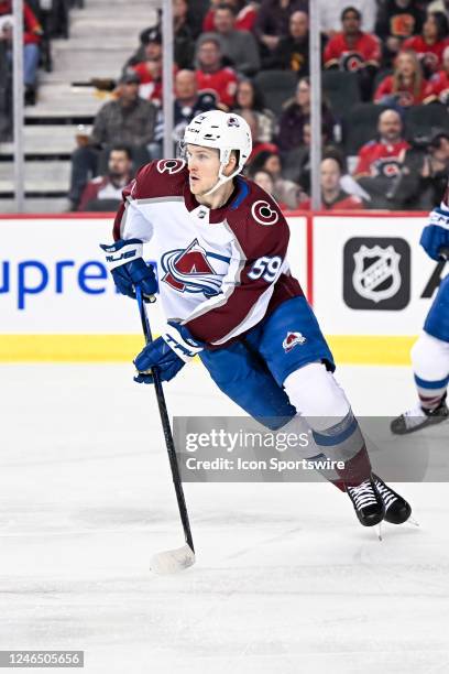 Colorado Avalanche Center Ben Meyers skates with the puck during the first period of an NHL game between the Calgary Flames and the Colorado...
