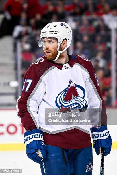 Colorado Avalanche Center J.T. Compher looks on during the first period of an NHL game between the Calgary Flames and the Colorado Avalanche on...