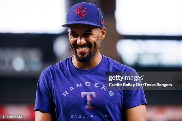 Marcus Semien of the Texas Rangers reacts during batting practice ...