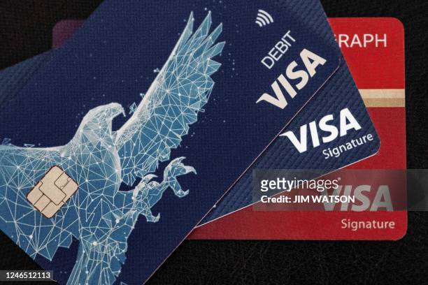 This photo illustration shows Visa cards on January 24 in Centreville, Maryland, ahead of their earnings report.