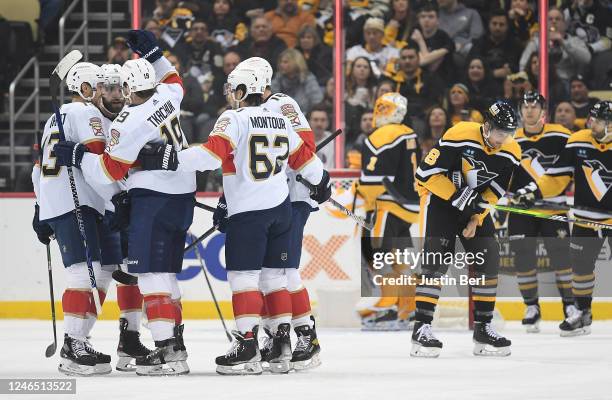 Matthew Tkachuk of the Florida Panthers celebrates with teammates after scoring a goal in the first period during the game against the Pittsburgh...