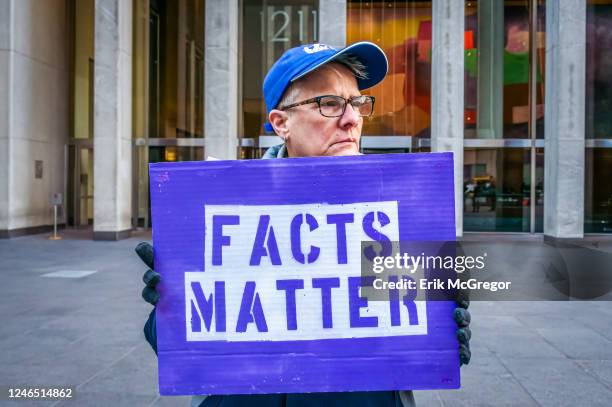 Participant seen holding a sign at the protest. Members of the activist groups Truth Tuesdays and Rise and Resist gathered at the weekly FOX LIES...