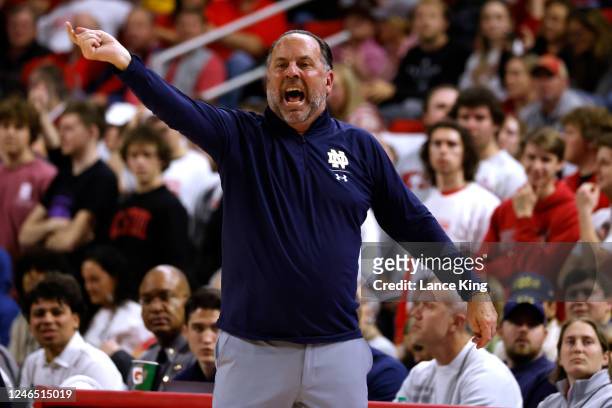 Head coach Mike Brey of the Notre Dame Fighting Irish directs his team during the second half of their game against the NC State Wolfpack at PNC...
