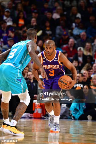 Chris Paul of the Phoenix Suns dribbles the ball during the game against the Charlotte Hornets on January 24, 2023 at Footprint Center in Phoenix,...