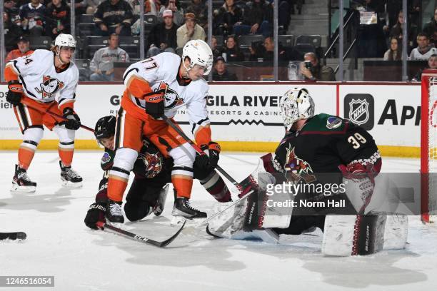 Connor Ingram of the Arizona Coyotes gets ready to make a save as Frank Vatrano of the Anaheim Ducks waits for a rebound during the second period at...