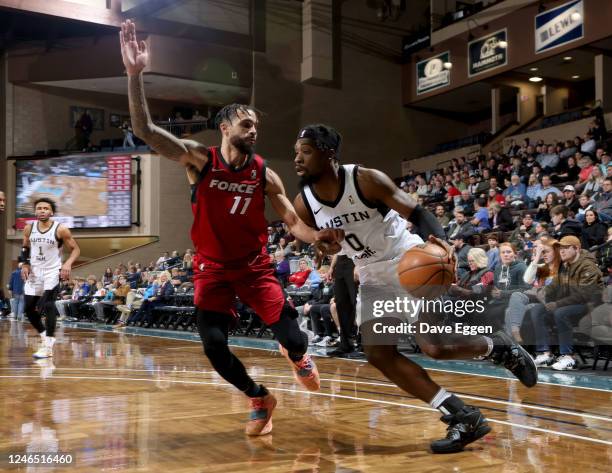 January 24: Adrian Delph of the Austin Spurs tries to drive to the basket against Mychal Mulder of the Sioux Falls Skyforce at the Sanford Pentagon...