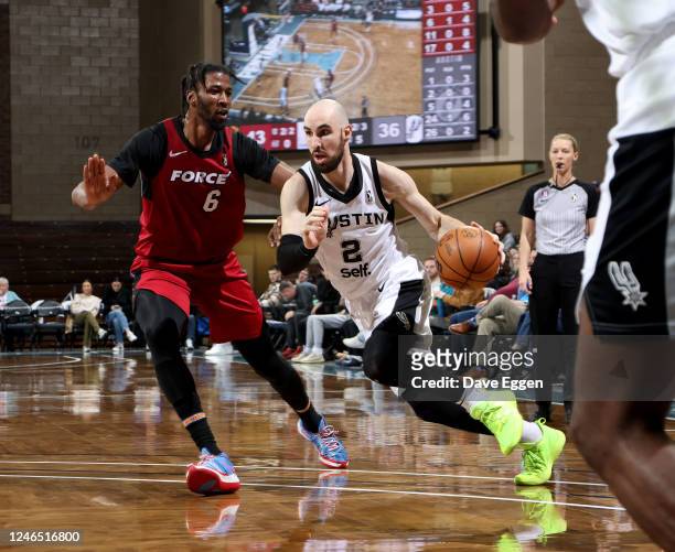 January 24: Tommy Kuhse of the Austin Spurs drives to the basket against Kadeem Jack of the Sioux Falls Skyforce at the Sanford Pentagon on January...