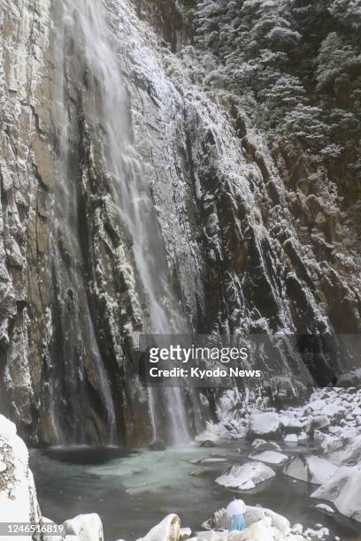 Photo taken on Jan. 25 shows World Heritage-listed Nachi Falls in Nachikatsuura in Wakayama Prefecture with its plunge pool frozen due to a severe...