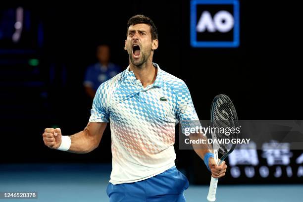 Serbia's Novak Djokovic reacts on a point against Russia's Andrey Rublev during their men's singles quarter-final match on day ten of the Australian...