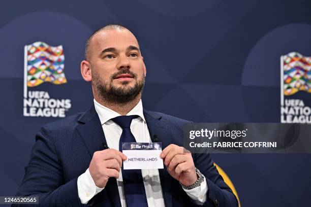 Dutch retired football player Wesley Sneijder shows the paper slip of Netherlands during the 2023 UEFA Nations League football finals draw in Nyon,...