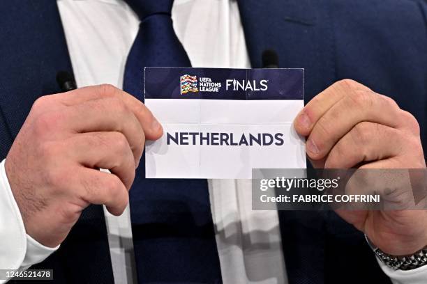 Dutch retired football player Wesley Sneijder shows the paper slip of Netherlands during the 2023 UEFA Nations League football finals draw in Nyon,...