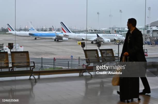 Passenger walks at the Charles de Gaulle Airport near Paris, France on January 25, 2023.