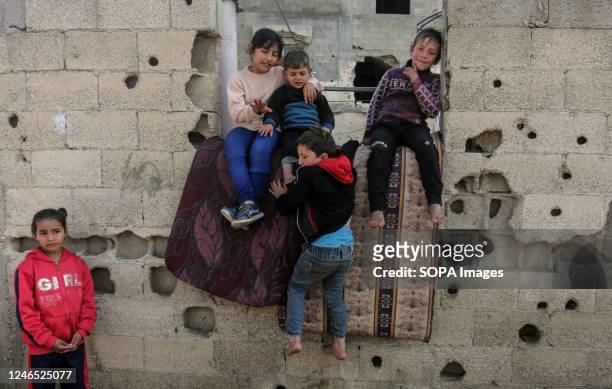 Palestinian children play in front of a house in a poor neighborhood in the town of Beit Lahiya in the northern Gaza Strip. This poor neighborhood is...