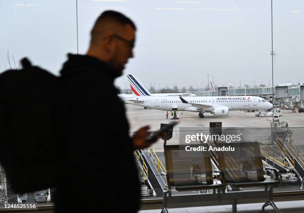 Passenger walks at the Charles de Gaulle Airport near Paris, France on January 25, 2023.