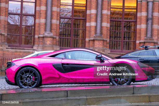 Chrome pink McLaren 540c parked outside St Pancras Renaissance Hotel in the borough of Camden, London United Kingdom on the 10th of January 2023.