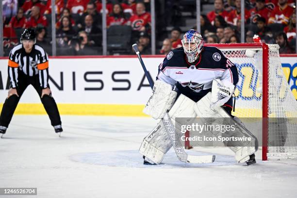 Columbus Blue Jackets Goalie Joonas Korpisalo covers his goal during the first period of an NHL game between the Calgary Flames and the Columbus Blue...