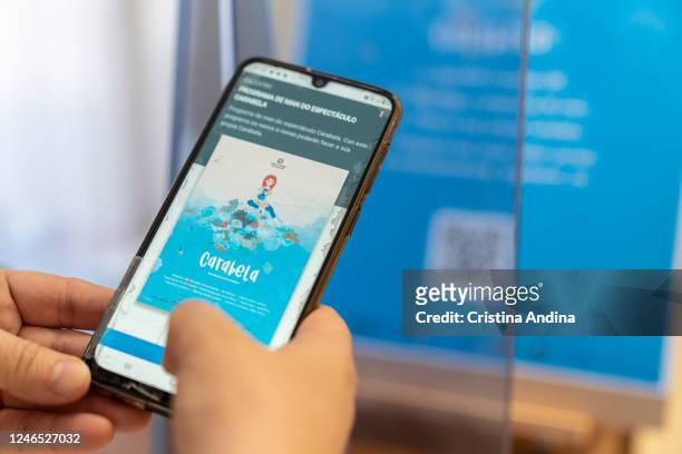 Virtual "Carabela" theatre program is seen on a phone at the "Carabela" show on June 5, 2020 in Muros, A Coruña, Spain. "Carabela" is the first...
