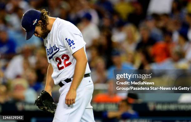 Los Angeles Dodgers starting pitcher Clayton Kershaw reacts after loading the bases in the seventh inning of a Major League Baseball National League...