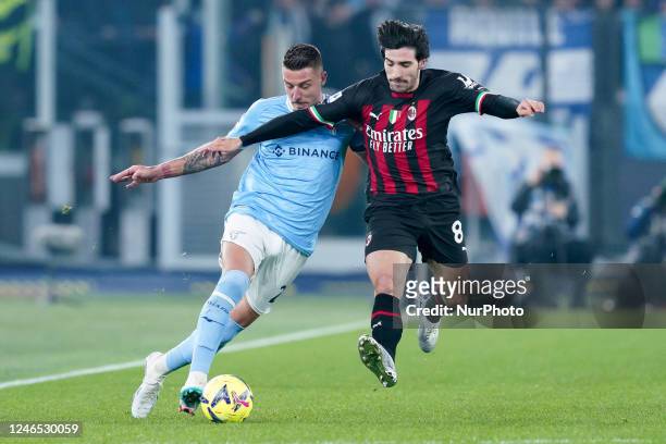 Sandro Tonali of AC Milan and Sergej Milinkovic-Savic of SS Lazio compete for the ball during the Serie A match between SS Lazio and AC Milan at...