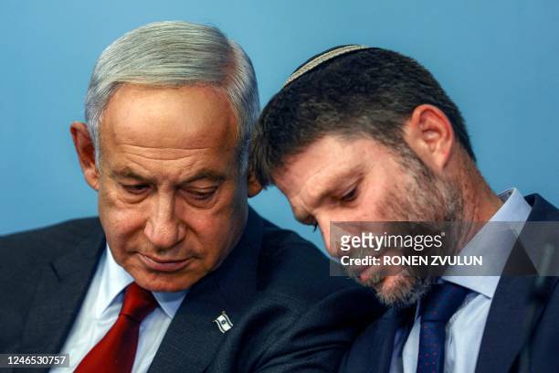 Israeli Prime Minister Benjamin Netanyahu and Finance Minister Bezalel Smotrich attend a press conference at the Prime Minister's office in Jerusalem...