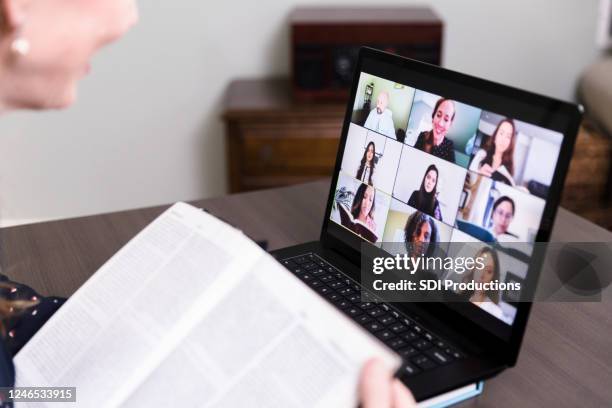 unrecognizable woman uses video conferencing for book club - theology stock pictures, royalty-free photos & images