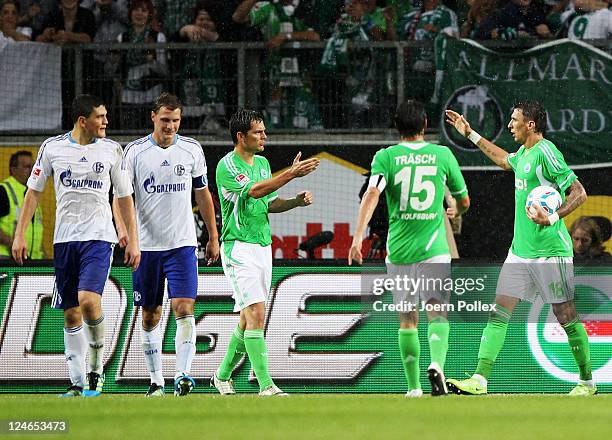 Mario Mandzukic of Wolfsburg celebrates with his team mates after scoring his team's first goalduring the Bundesliga match between VfL Wolfsburg and...