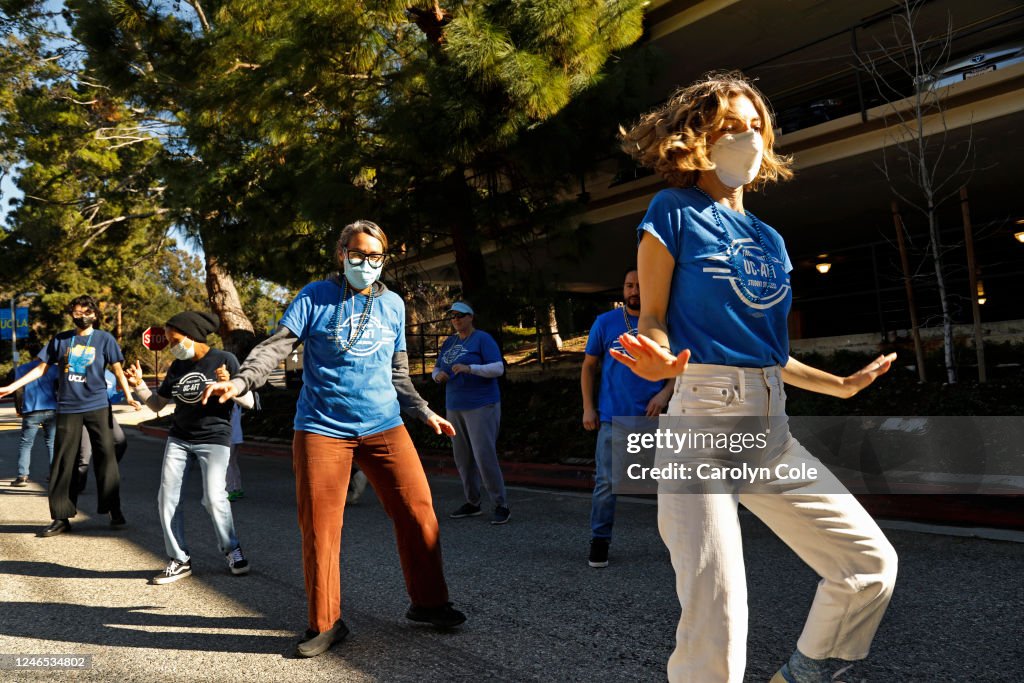 UCLA lab school students, teachers, and supporters march through UCLA campus on Jan. 25, 2023. They are on strike because the university is not bargaining with them on their proposals
