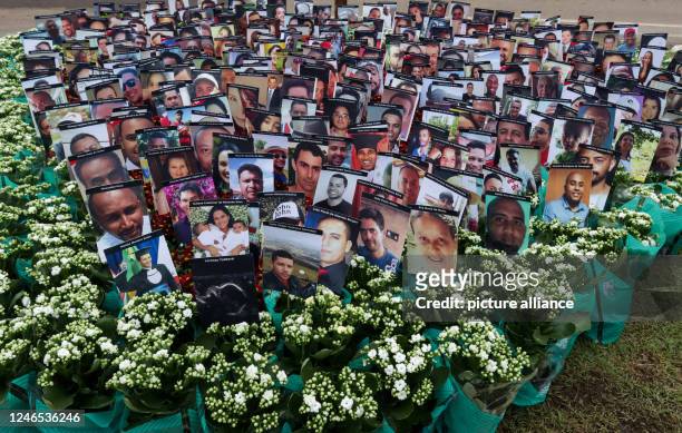 January 2023, Brazil, Brumadinho: Pictures of people who died in the Brumadinho dam collapse are seen during a commemoration ceremony marking the...