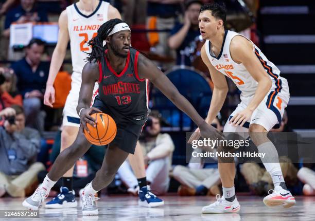 Isaac Likekele of the Ohio State Buckeyes dribbles against RJ Melendez of the Illinois Fighting Illini at State Farm Center on January 24, 2023 in...