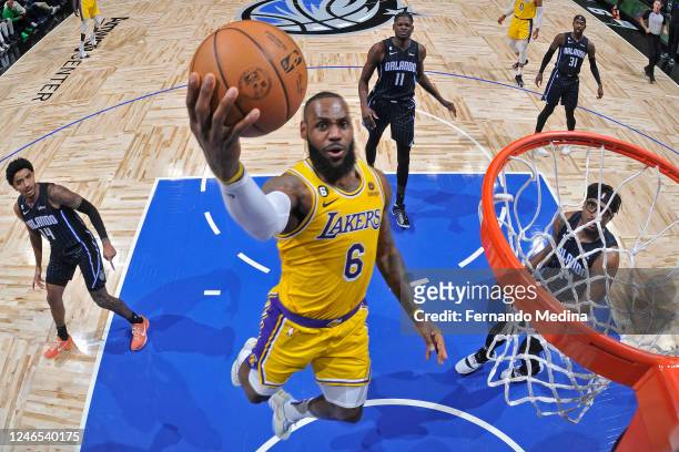 LeBron James of the Los Angeles Lakers drives to the basket during the game against the Orlando Magic on December 27, 2022 at Amway Center in...