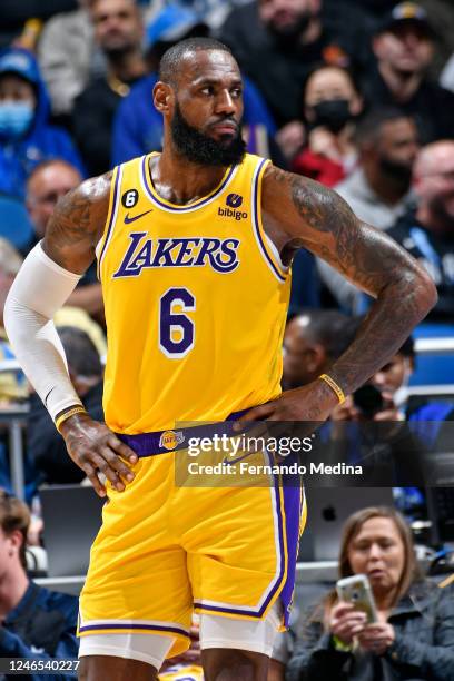 LeBron James of the Los Angeles Lakers looks on during the game against the Orlando Magic on December 27, 2022 at Amway Center in Orlando, Florida....