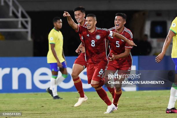 Colombia's Gustavo Puerta celebrates after scoring against Brazil during the South American U-20 championship first round football match at the...