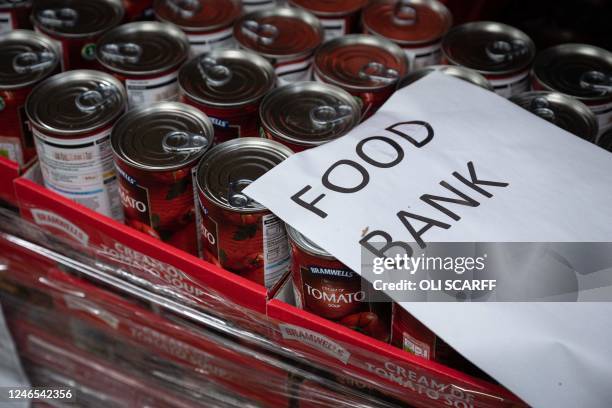 Tins of tomato soup are stacked at The Halo Centre, the central distribution point for donated items to be distributed to the Coventry Foodbank...