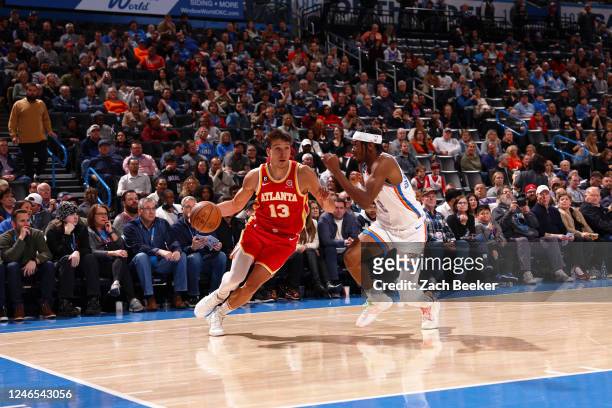 Bogdan Bogdanovic of the Atlanta Hawks drives to the basket during the game against the Oklahoma City Thunder on January 25, 2023 at Paycom Arena in...