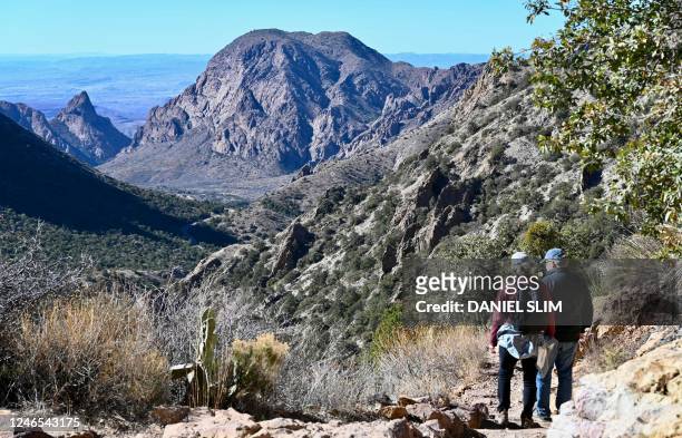 Hikers walk the train around the Chisos Basin of the Big Bend National Park in Texas on January 25, 2023. - Big Bend is a remote region of the state...