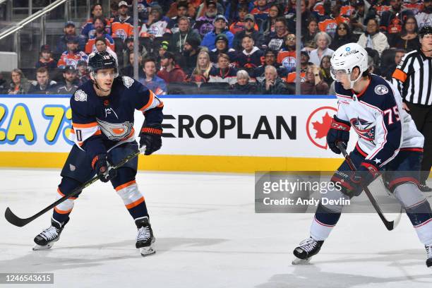 Derek Ryan of the Edmonton Oilers and Tim Berni of the Columbus Blue Jackets track the play during the game on January 25, 2023 at Rogers Place in...