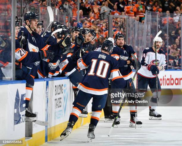 Derek Ryan of the Edmonton Oilers celebrates his second-period goal against the Columbus Blue Jackets with his teammates at the bench during the game...