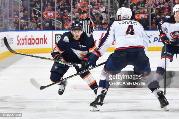 Derek Ryan of the Edmonton Oilers and Vladislav Gavrikov of the Columbus Blue Jackets skate during the game on January 25, 2023 at Rogers Place in...