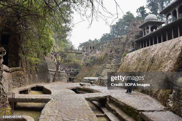 Visitor explores The Rock Garden of Chandigarh. Founded in the late 1950s by a government official called Nek Chand Saini, the Rock Garden of...