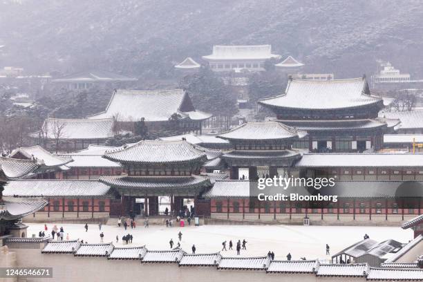 Gyeongbokgung Palace as snow falls in Seoul, South Korea, on Thursday, Jan. 26, 2023. Colder-than-usual weather is set to prevail in North Asia until...